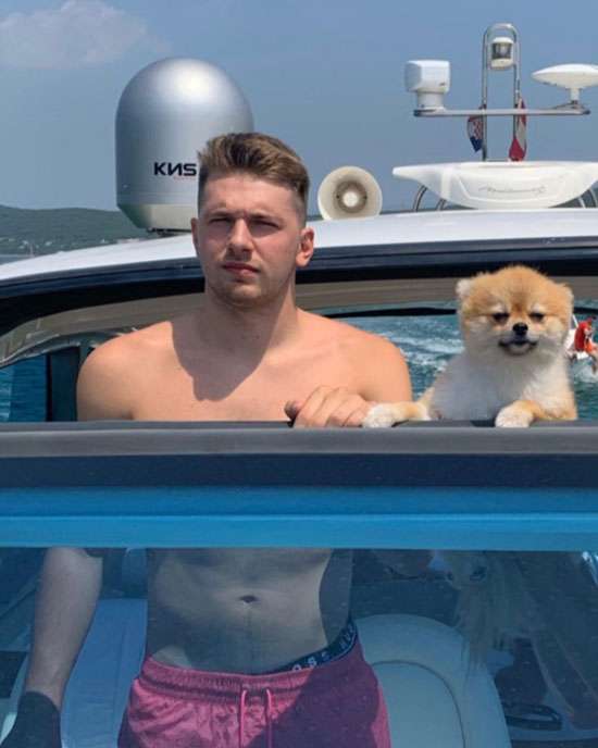 Luka In A Boat With His Puppy