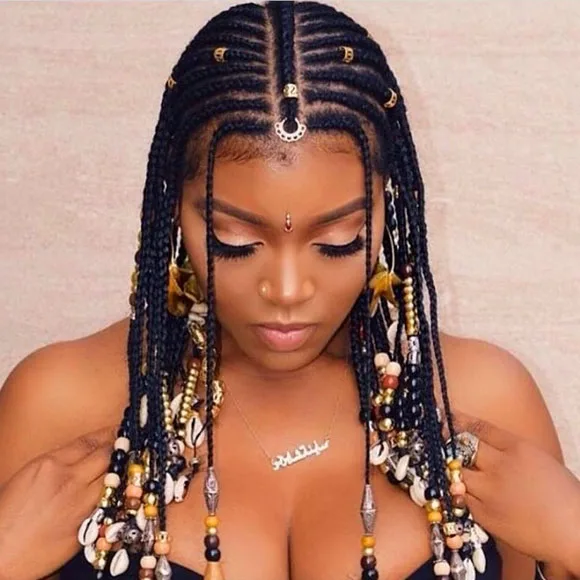 Intricate cornrow style with beads on each braid