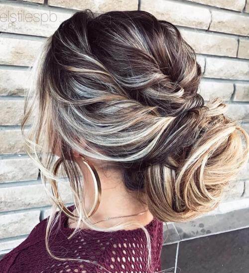 Low Bun With Twisted Side Braid