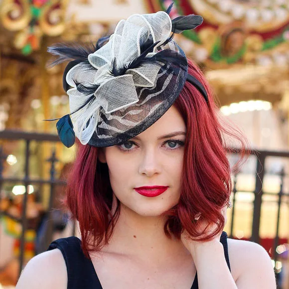 Quinceanera hairstyle with a fascinator