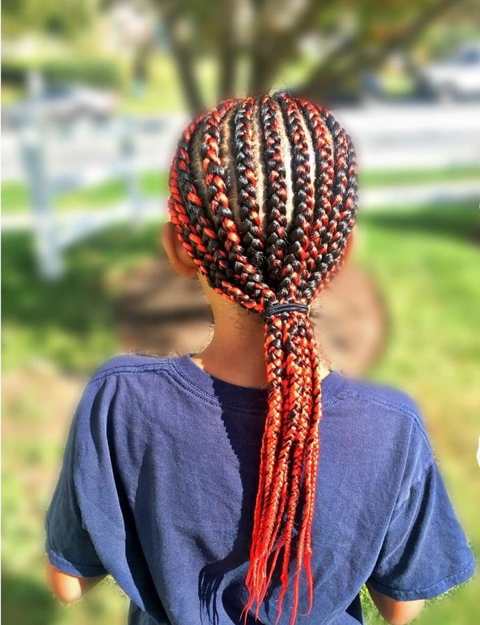 boy with long braided ponytail