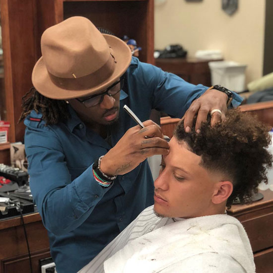 Patrick Mahomes is triming hair with his barber