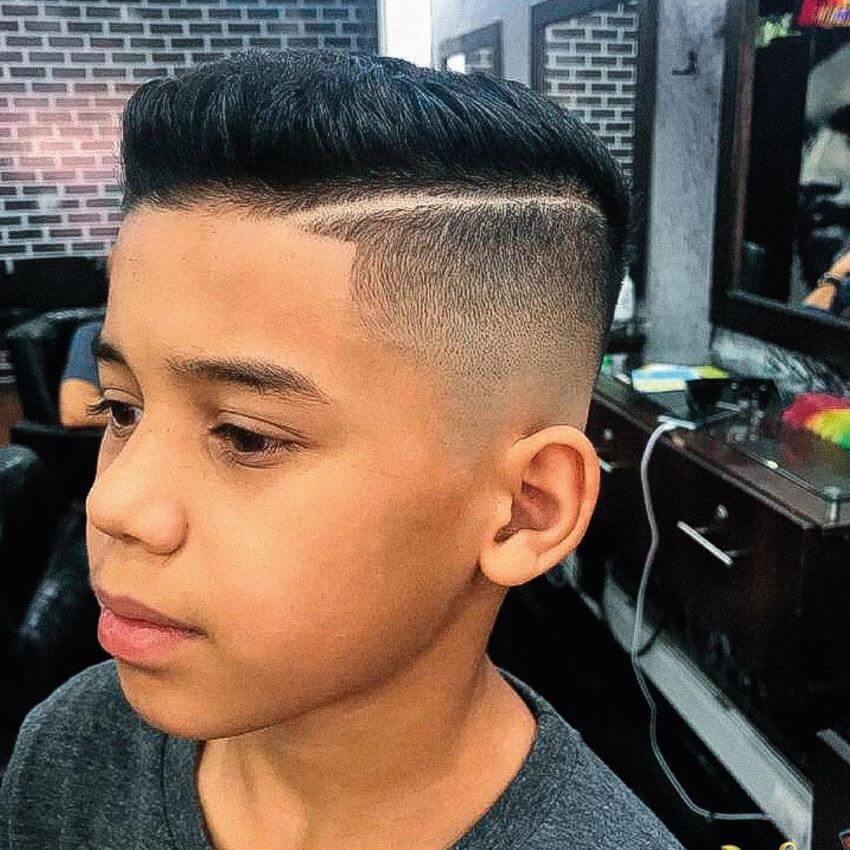 Side Swept Hairstyle With Hard Part And Fade