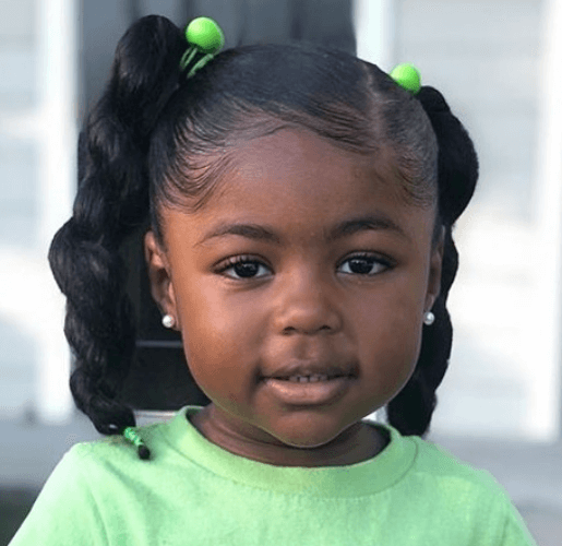 Slicked Side Swept Hair With Braided Pigtails